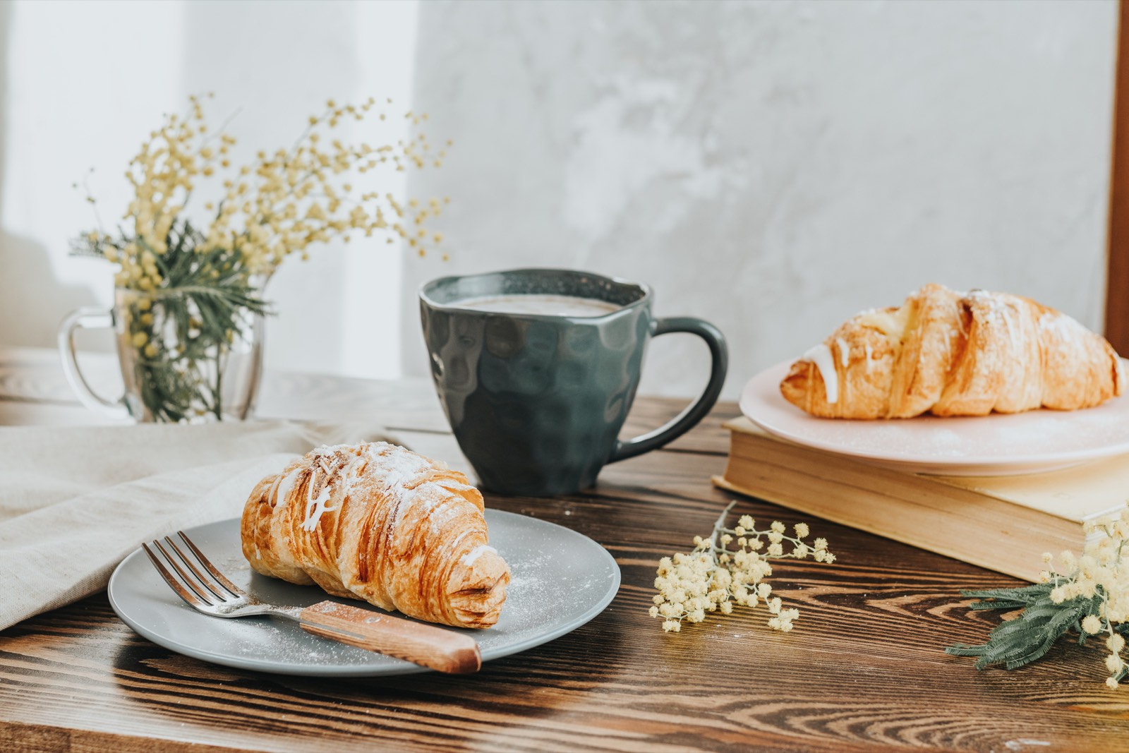 Coffee and fresh croissants on a café table