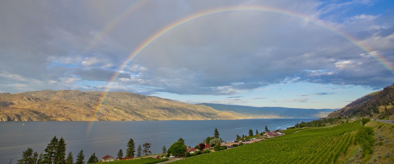 A double rainbow over Okanagan Lake and Summerlandâs vineyards